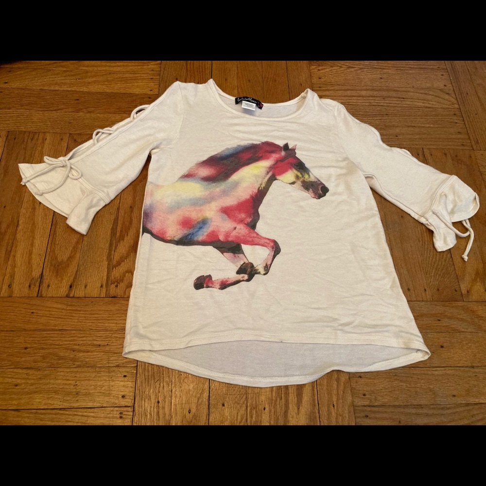Unicorn Shirt with arms out on the side